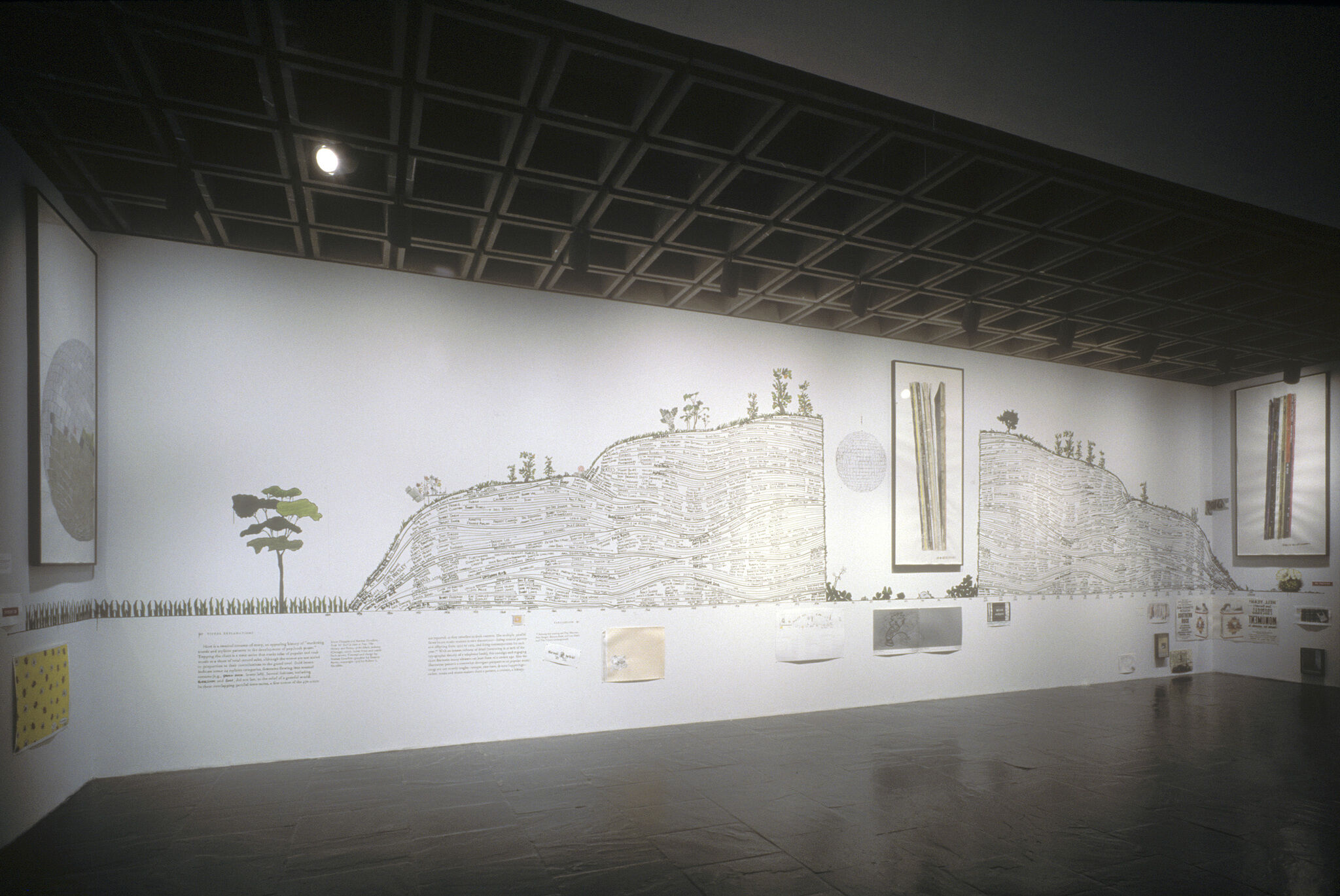 Gallery walls covered in various drawings and text.