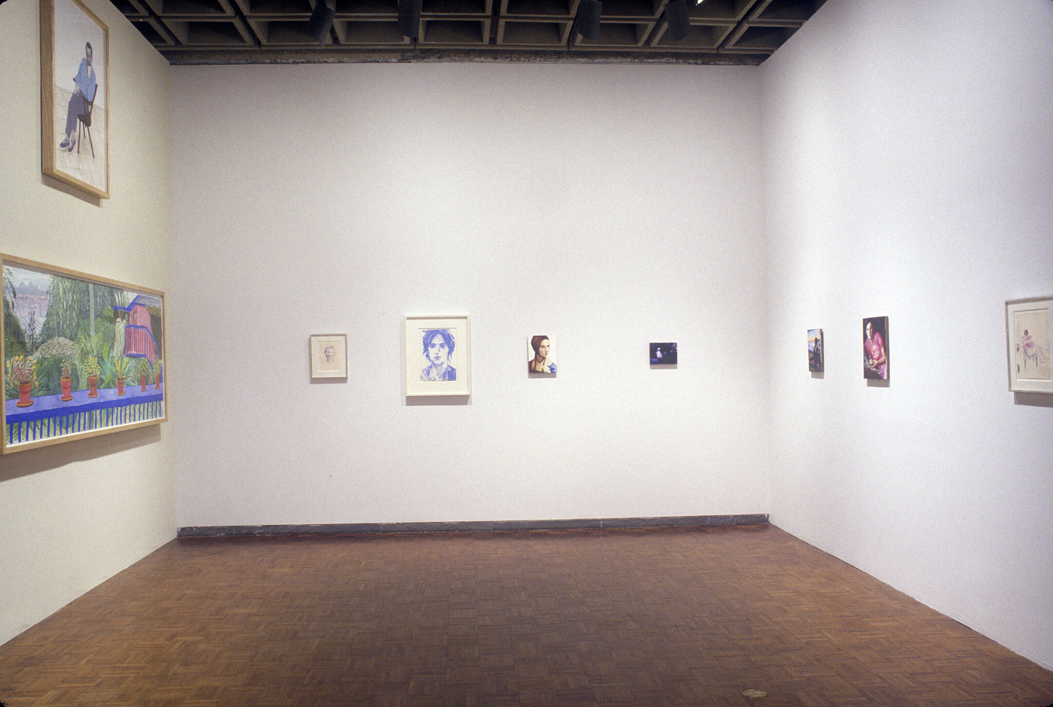 A gallery filled with drawings and paintings.