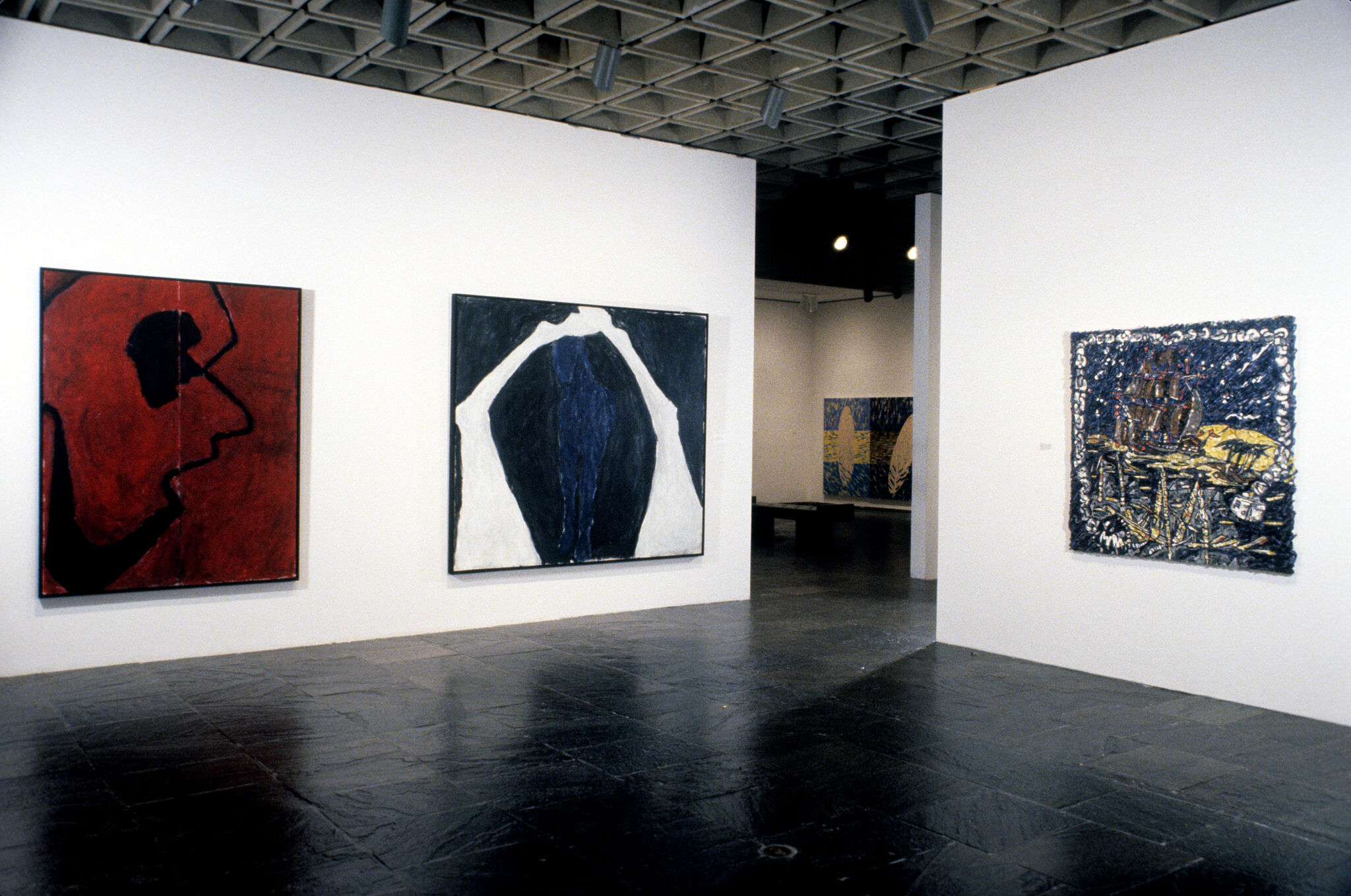 Works of art hanging in a gallery.