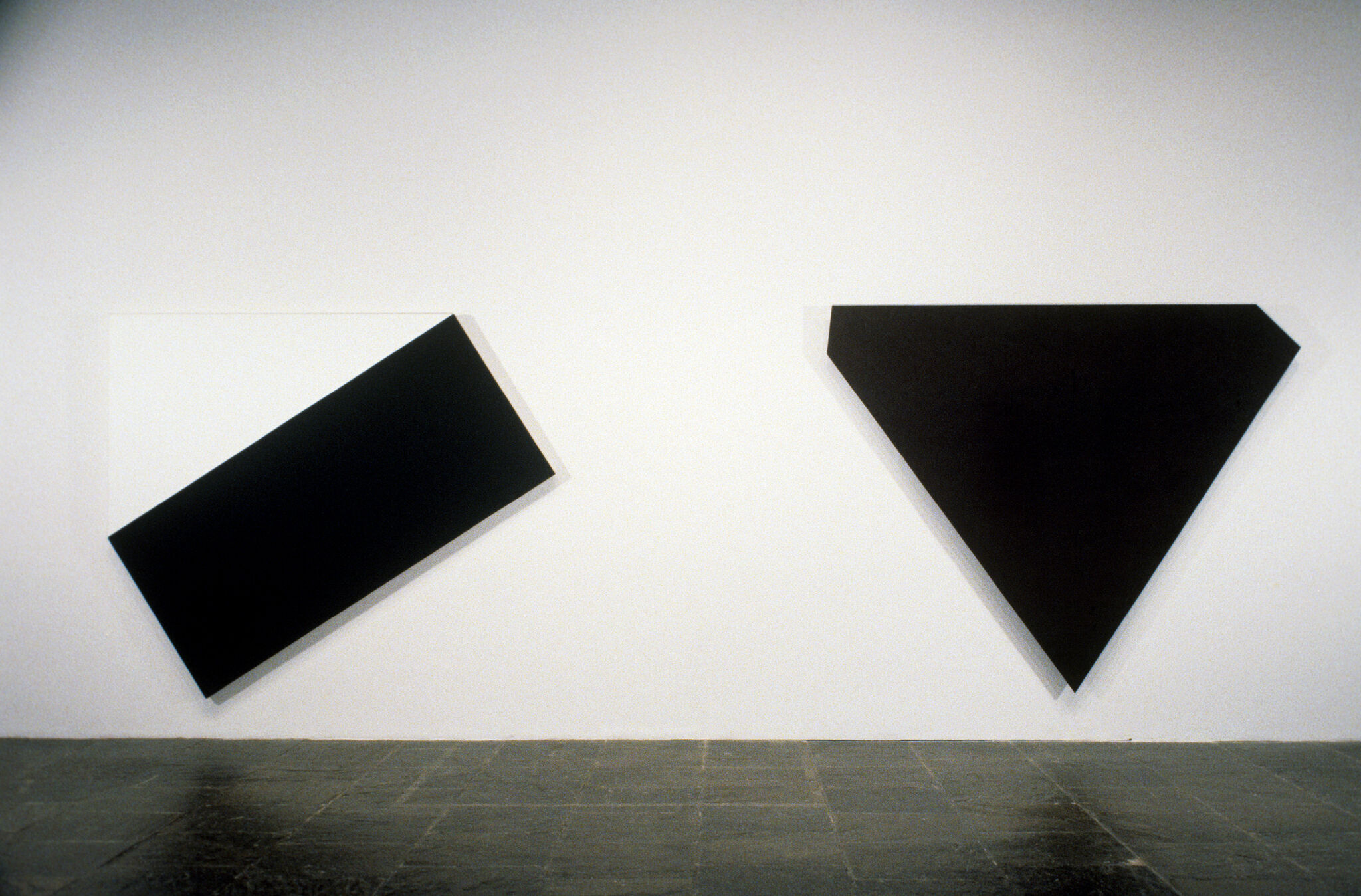 Two works of art in a gallery.