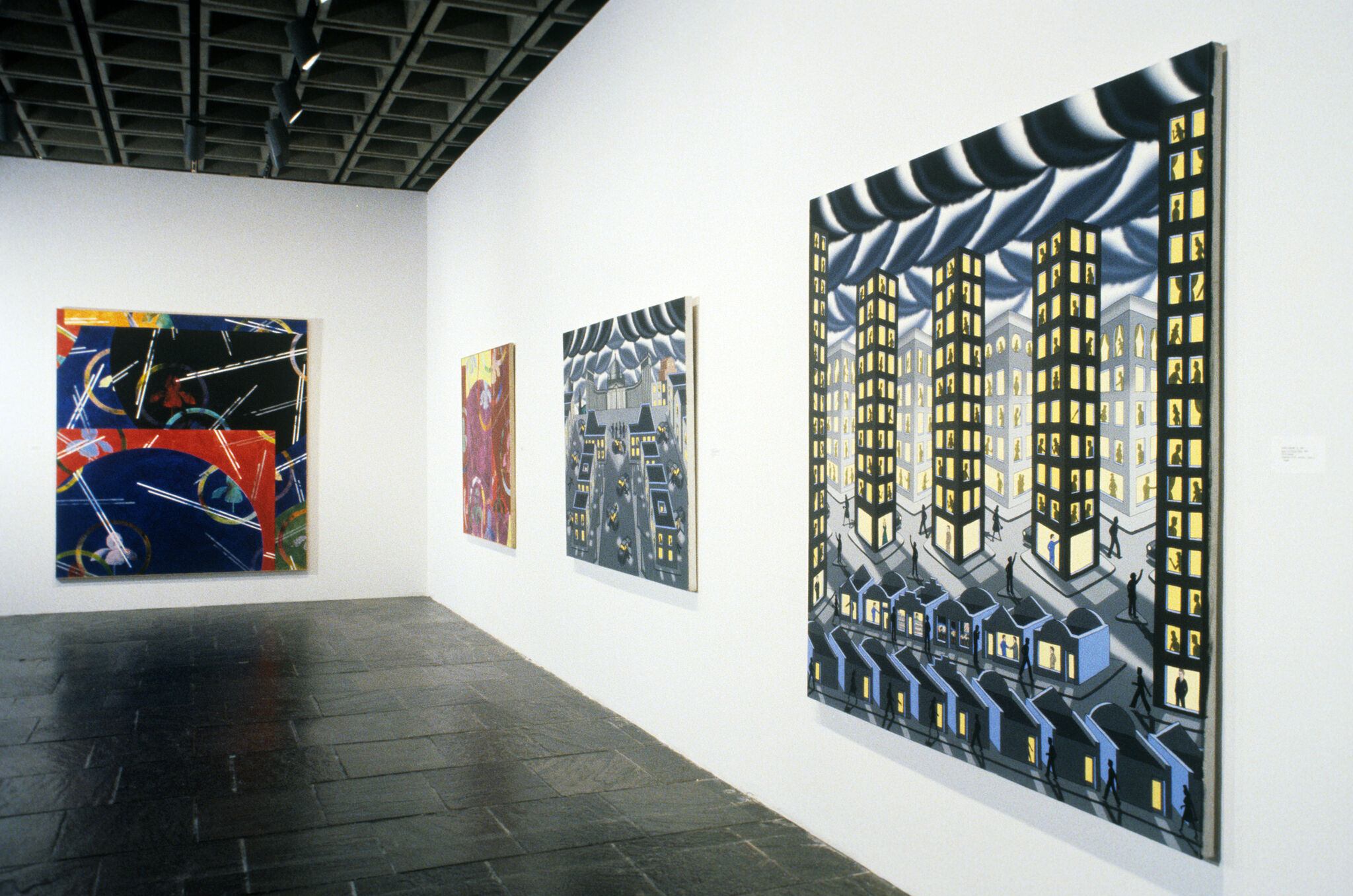 Works of art hanging in a gallery.