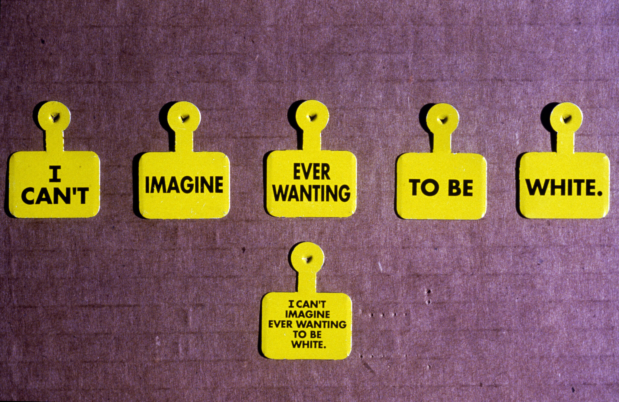 Yellow admission pins.