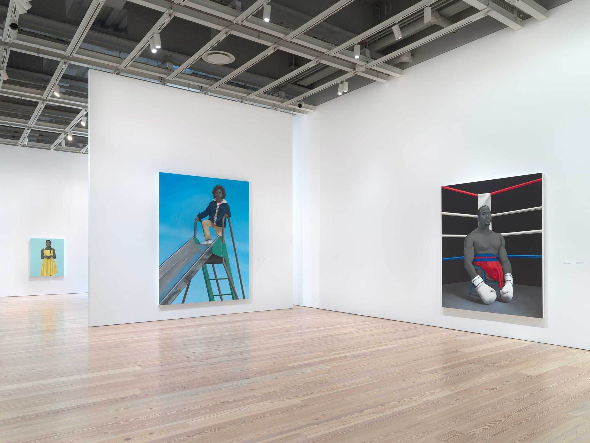 Three large paintings in a gallery show a girl in a yellow dress, a child on a slide, and a boxer.