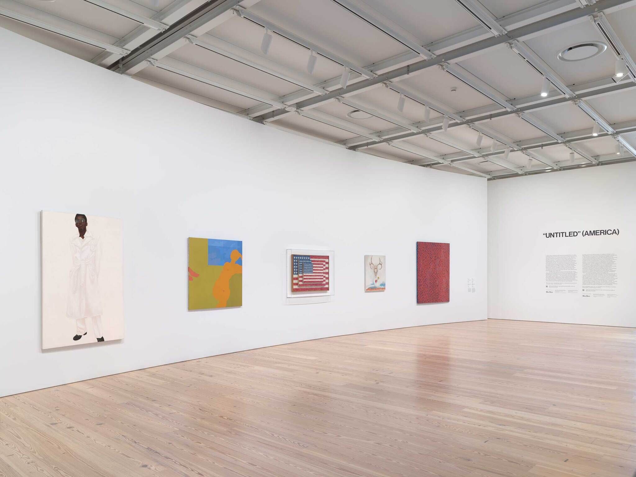 Six modern artworks hang on a white gallery wall, with the title “UNTITLED (AMERICA)” displayed in large text.