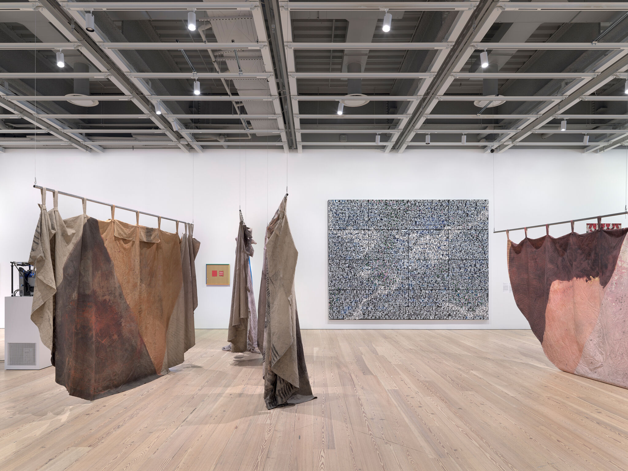 Fabrics hung from the ceiling or on poles